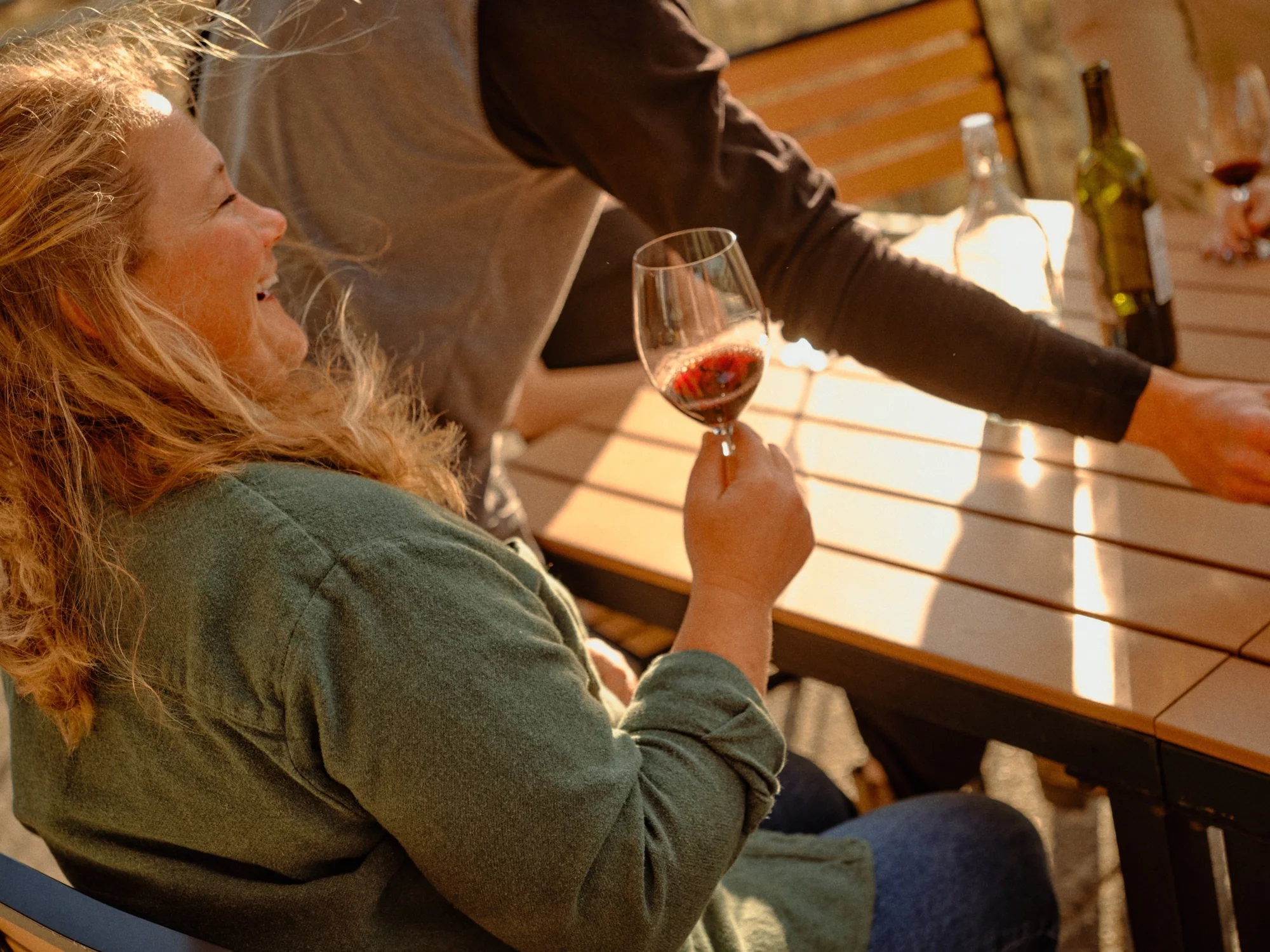 Tasting Room Gallery Woman holding wine glass at table